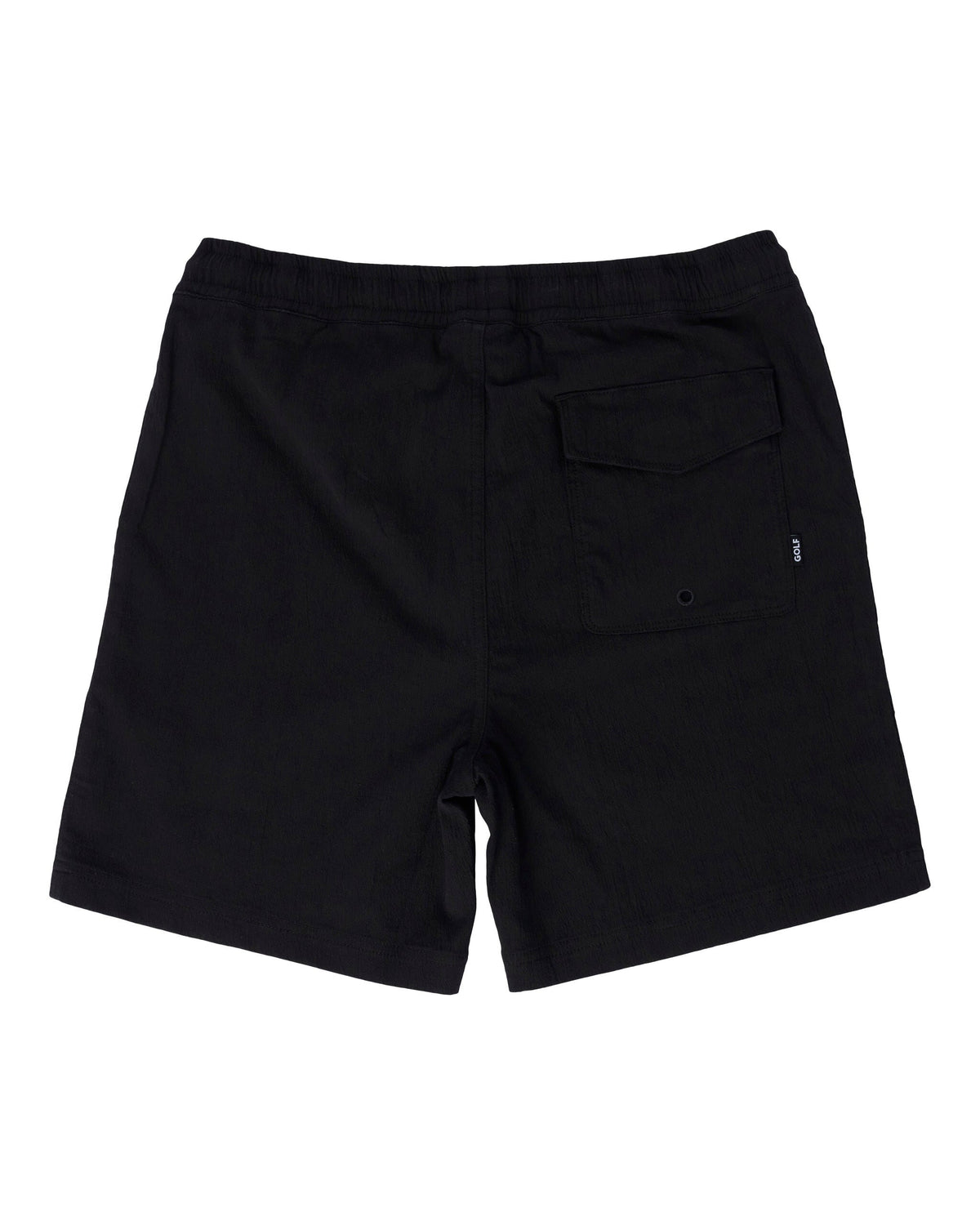 Back of black shorts featuring an elastic waistband and a Velcro flap back pocket with a small logo tag.