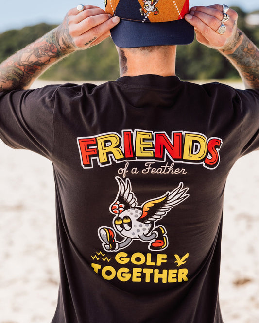 Back of a man wearing a black T-shirt with a large Friends of a Feather Golf Together graphic.