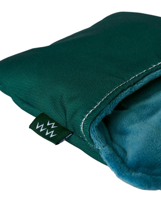 Detail of an alpine green mallet putter headcover with white stitching, a soft teal lining, and a logo tag.