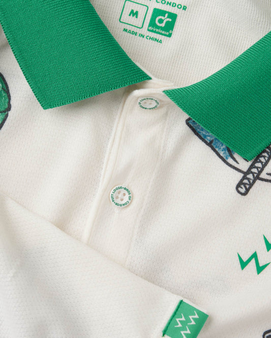 Detail of an off-white polo shirt with a green ribbed collar, shark print, and three buttons.