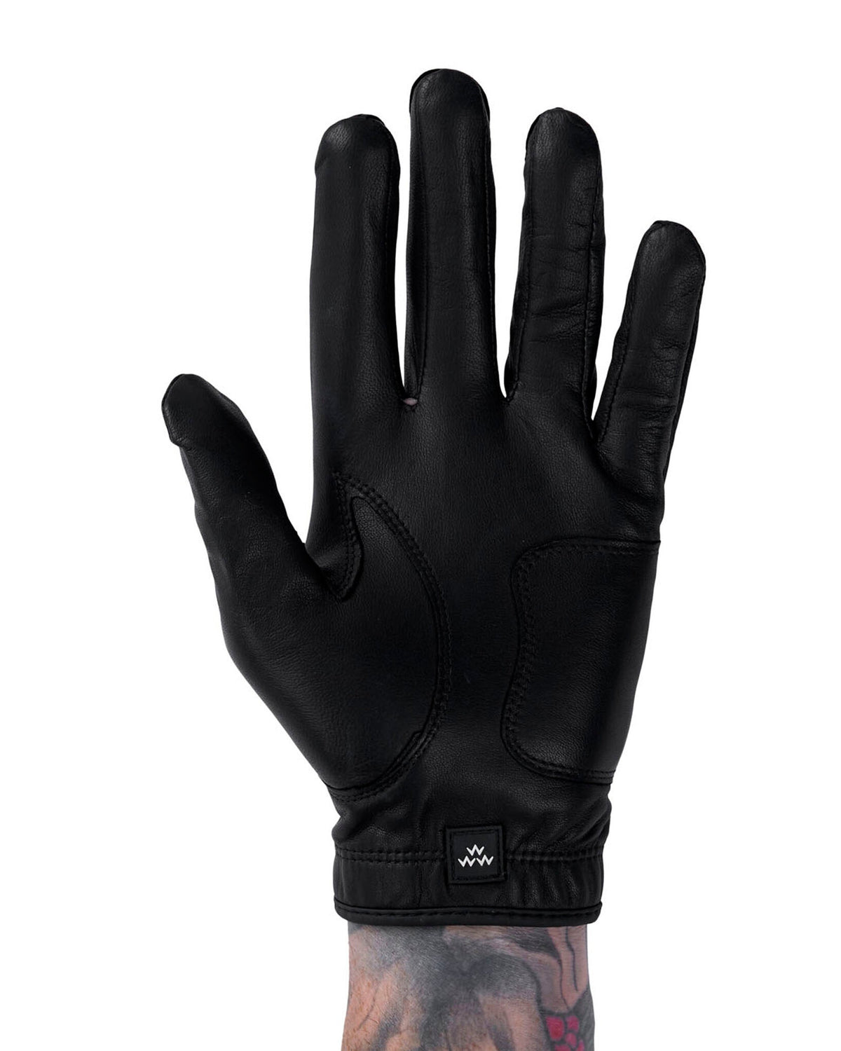 Front of a black leather golf glove with a stitched panel design and a small square logo on the wrist.