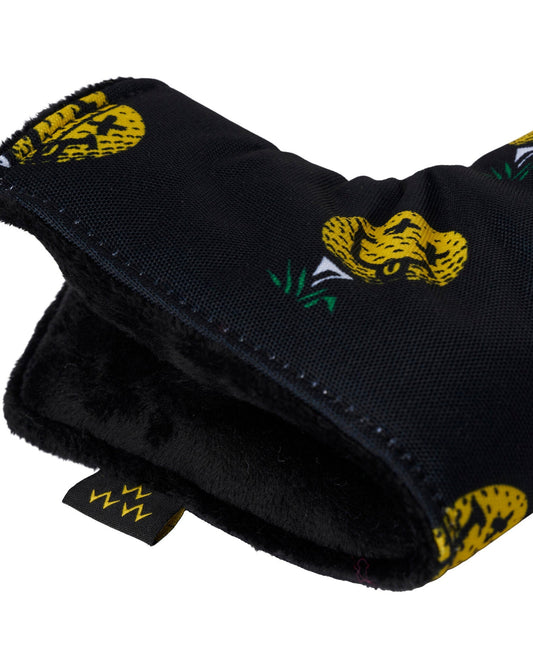 Detail of a black blade headcover featuring an all-over graphic of yellow snakes in green grass.