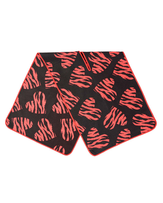 Black golf towel with waffle texture and an all-over red tiger-stripe heart print, featuring a centre slit.