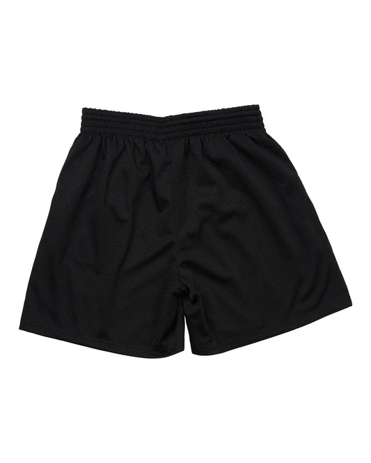 Back of black mesh shorts featuring an elastic waistband and standard length cut.