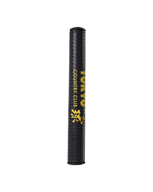Black putter grip with a textured surface and gold Tokyo Country Club lettering and Japanese text.