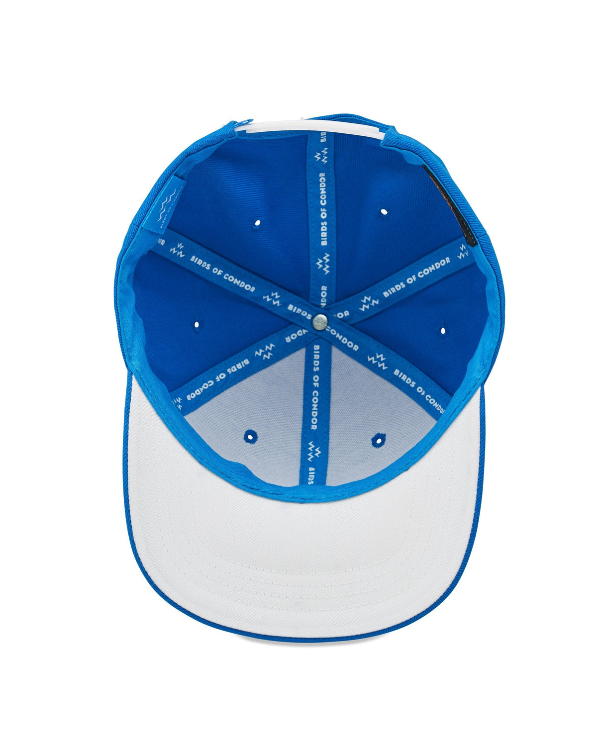 Inside view of an electric blue snapback cap with white taped seams and printed logo branding.