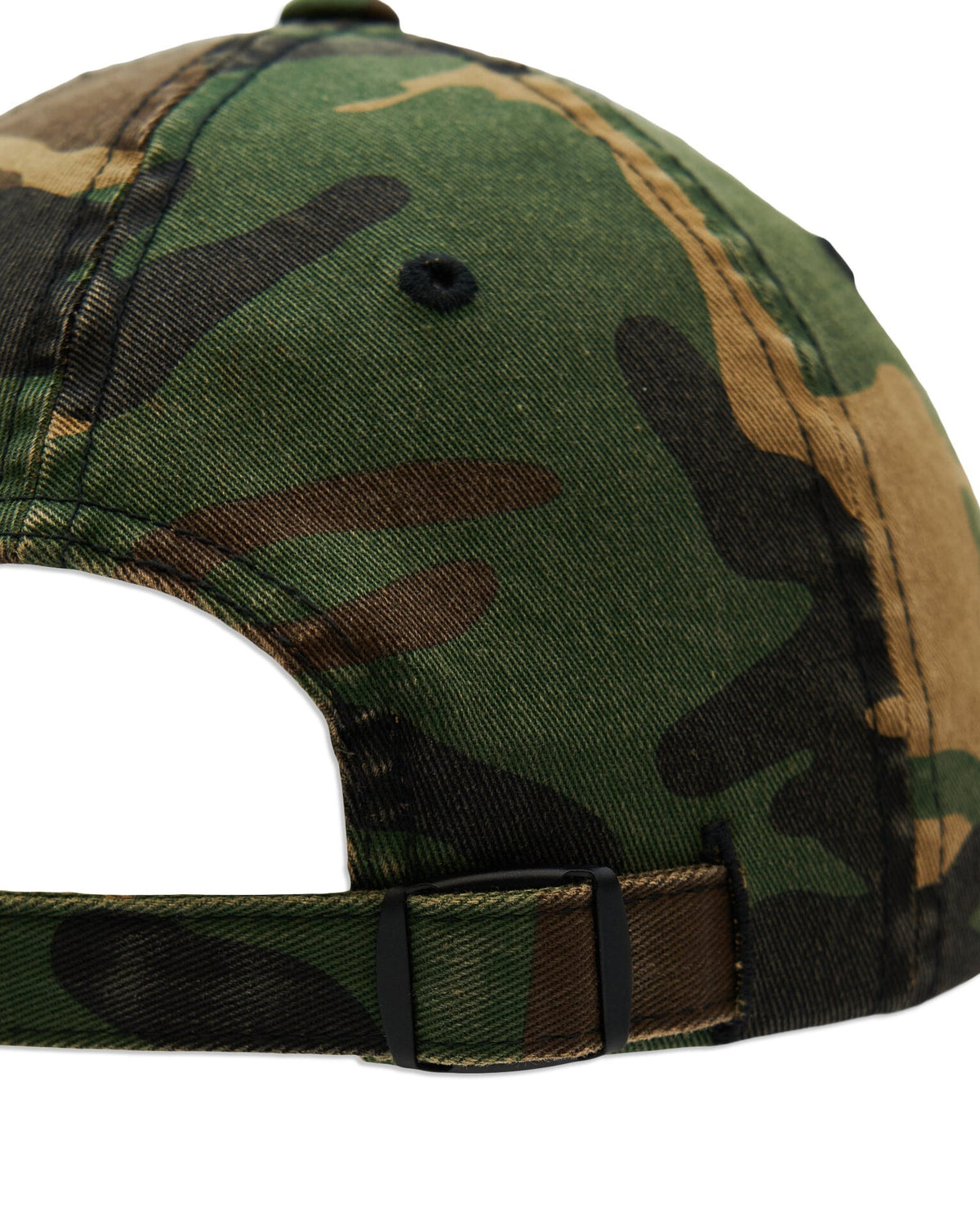 Back of a camo cotton cap featuring an adjustable strap with a black metal buckle closure.