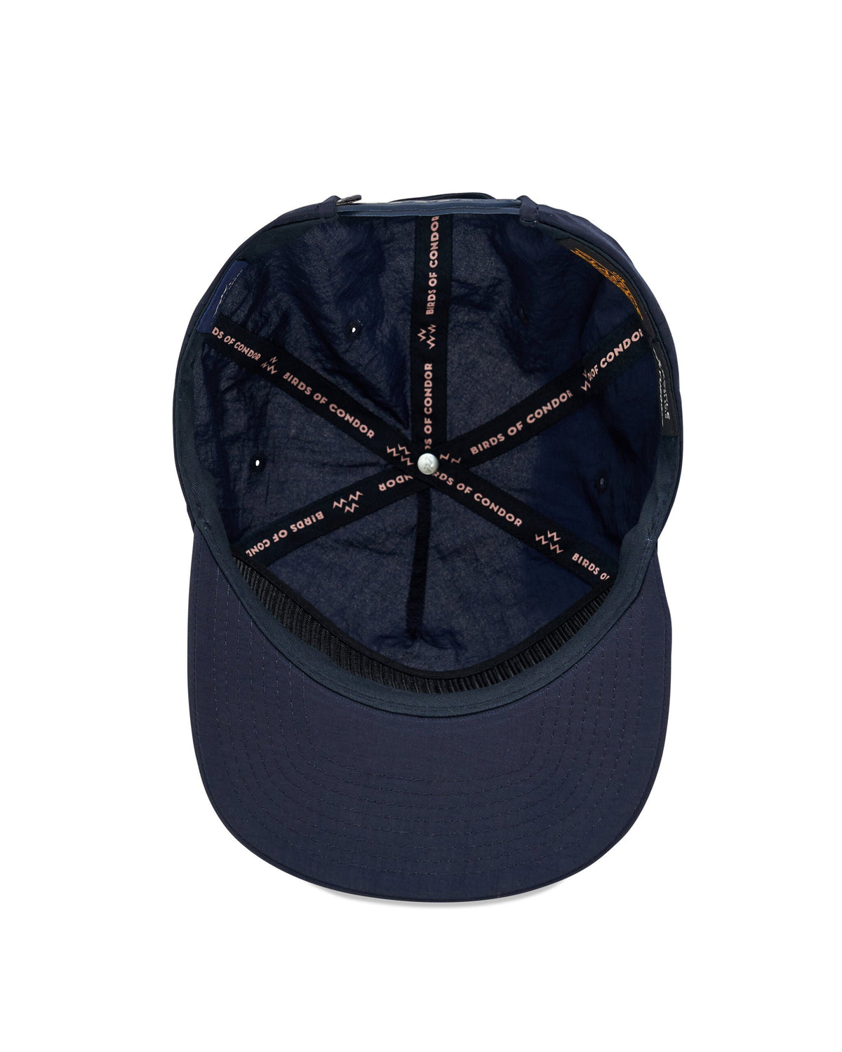 Inside view of a navy snapback hat with branded interior taping across the crown seams.