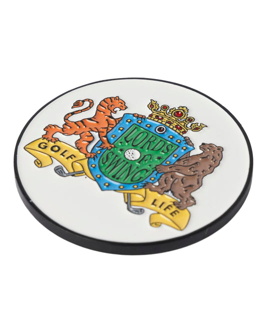 A white golf ball marker with a crest featuring a tiger, a bear, a crown, and the text LORDS OF SWING.