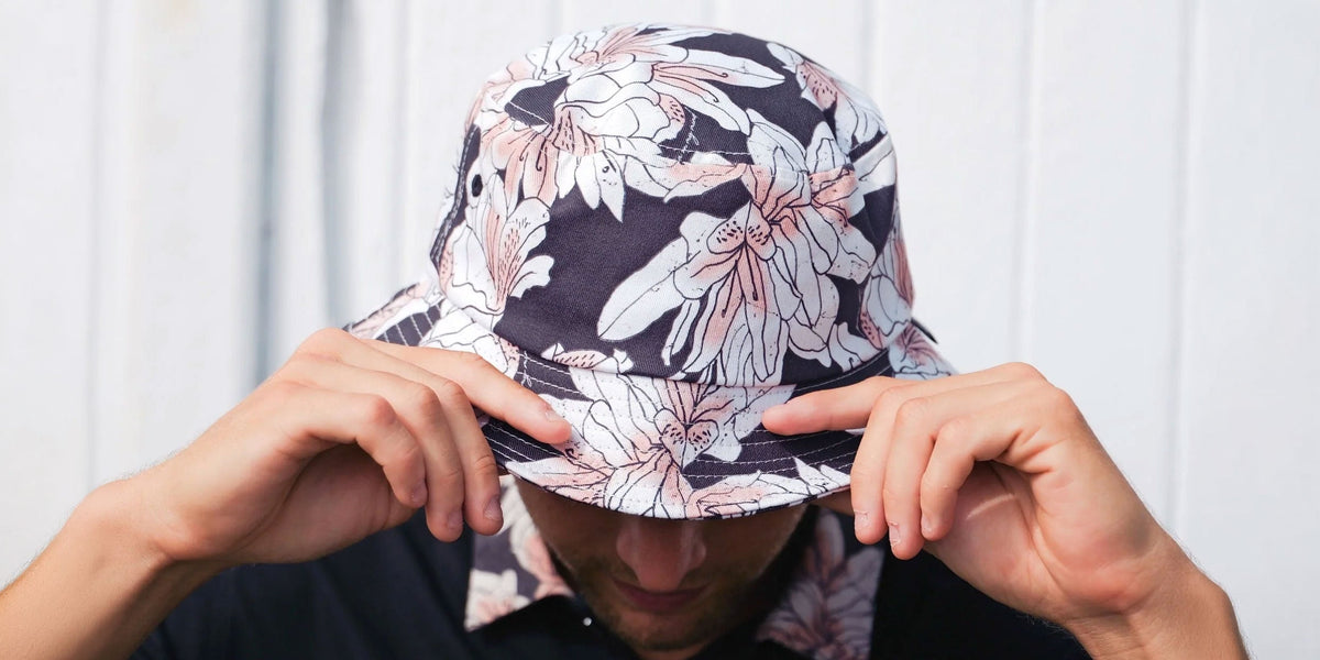Man with golf bucket hat with azalea flower pattern