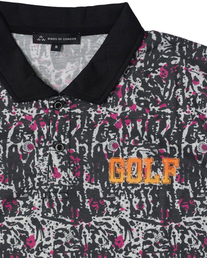 Detail of a black polo shirt with pink and grey golf print, black collar, and orange GOLF chest text.