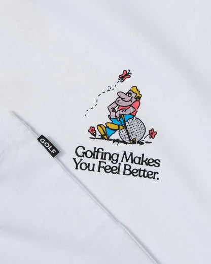 Detail of a white t-shirt with a golfer graphic and Golfing Makes You Feel Better text below.