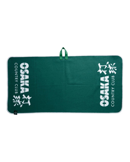Alpine green golf towel with a waffle texture, white trim, hanging loop, and printed Osaka Country Club text.