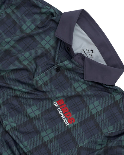 Detail of blue and green plaid polo shirt with solid collar, button placket, and red chest logo.