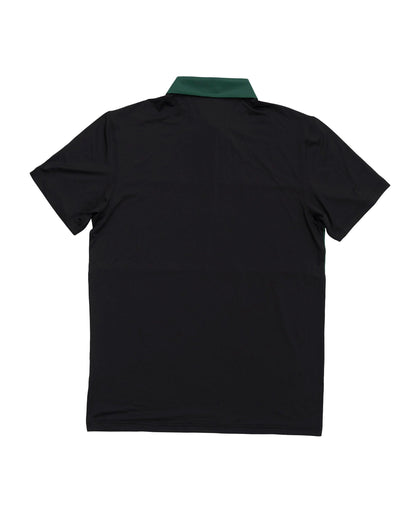 Back of a black polo shirt featuring a contrast green collar and a horizontal mid-block panel.