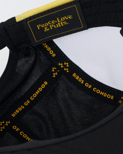 Detail of a black sports cap interior showing branded seam tape and a text label reading Peace, Love & Putts.