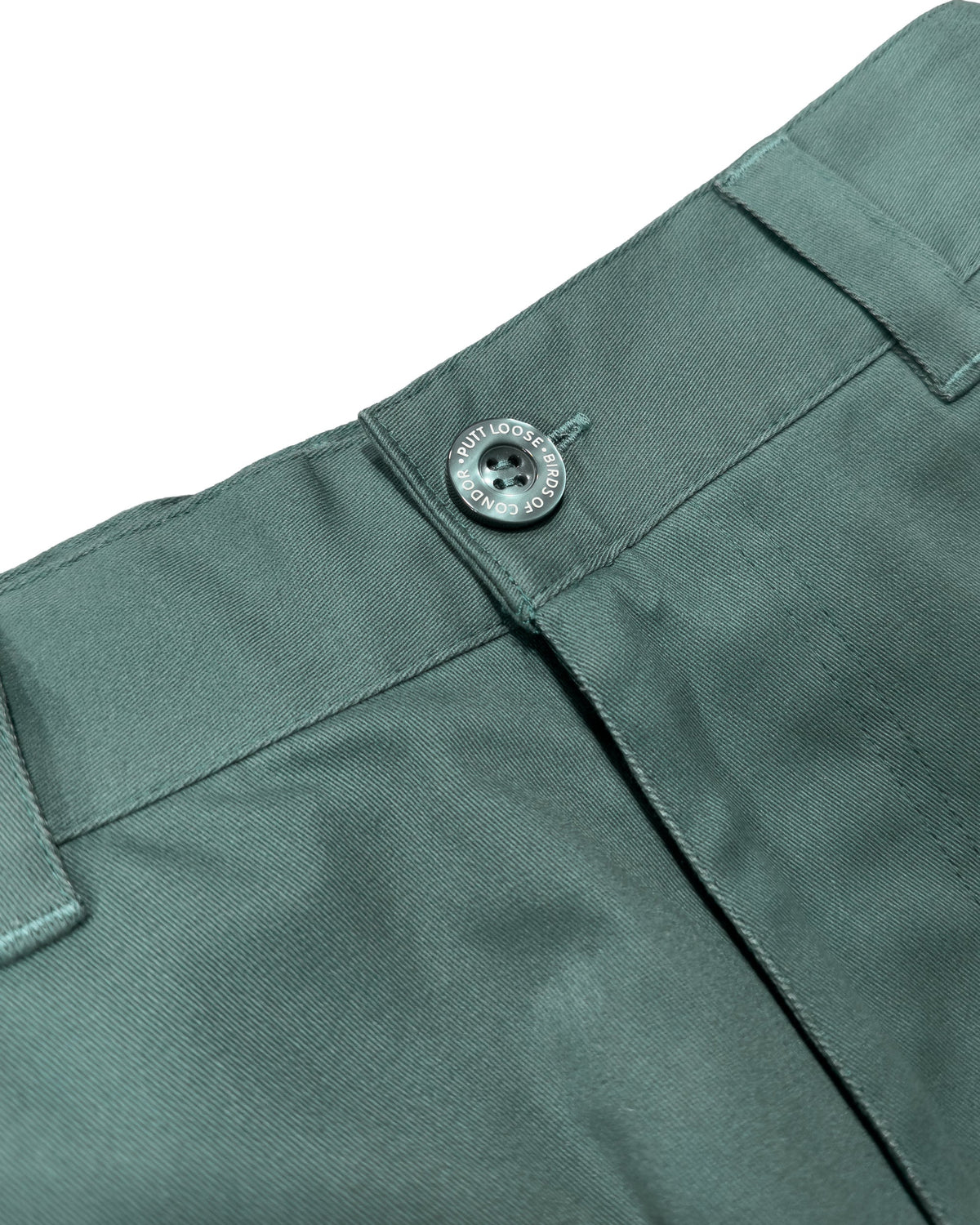 Detail of khaki green shorts with a fixed waistband, belt loops, and a dark button.