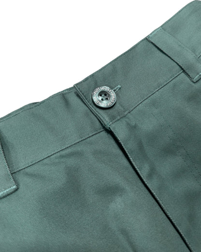 Detail of khaki green shorts with a fixed waistband, belt loops, and a dark button.