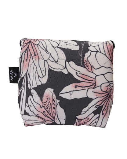 An azalea print mallet putter cover with pink and white flowers on a dark background.