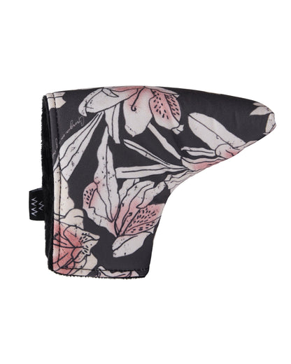An azalea print blade putter cover with pink and white flowers on a black background, featuring a magnetic closure.
