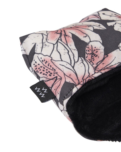 Detail of an azalea print mallet headcover with a black inner lining and a small branded tag on the side.
