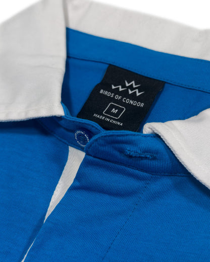 Detail of a blue sweater with a white collar and a hidden button placket.
