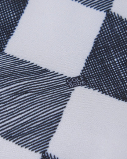 Detail of a black and white bucket hat in a custom gingham print featuring the Golf Babe logo.