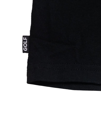 Detail of a black cotton t-shirt hem featuring a small woven label with the word GOLF in white.