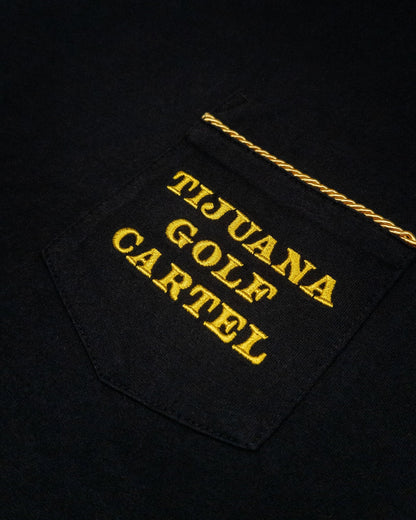 Detail of a black cotton t-shirt pocket with gold text and twisted rope trim.
