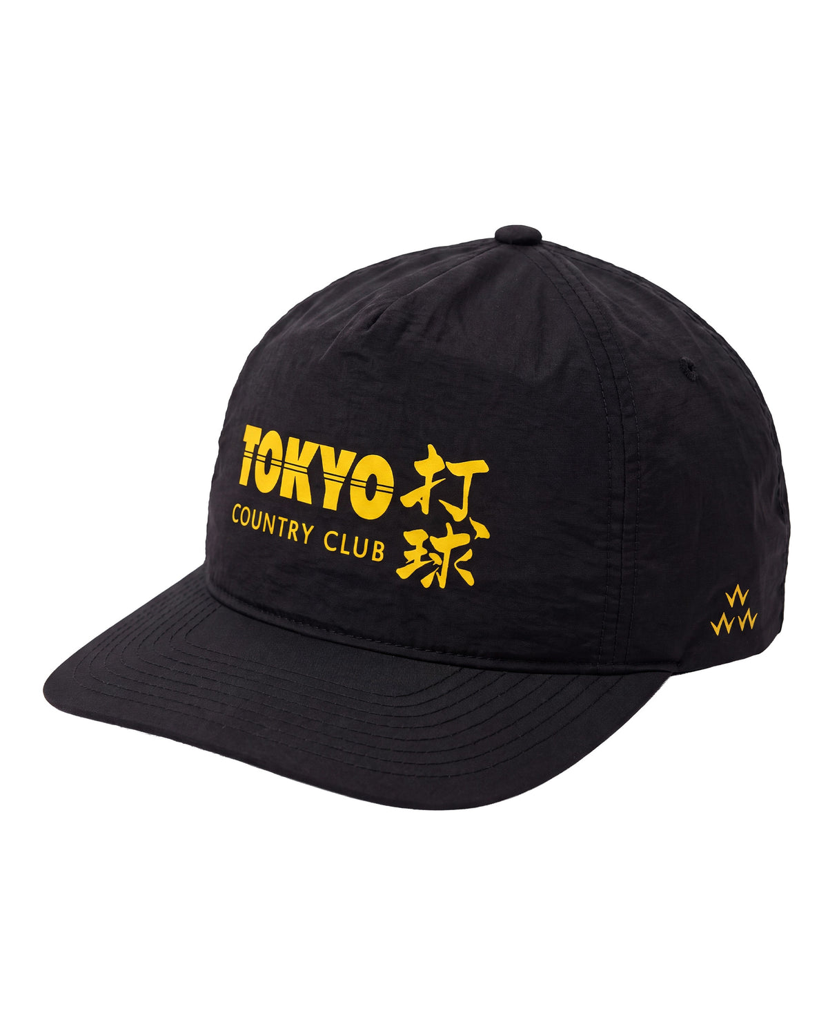 Black nylon snapback featuring bold yellow Tokyo Country Club lettering and Japanese characters on the front.