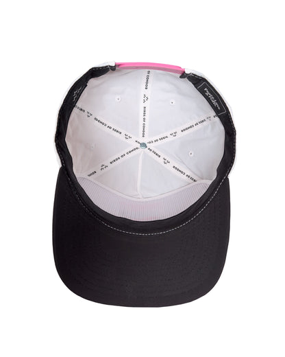 Interior of a white snapback with taped seams and a contrasting pink strap.