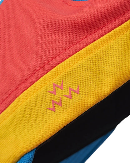 Detail of a multi-colour sports cap with a yellow panel featuring a pink zig-zag design.