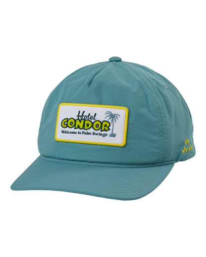 Mist five-panel nylon snapback with a rectangular front patch depicting a palm tree and Hotel Condor text.