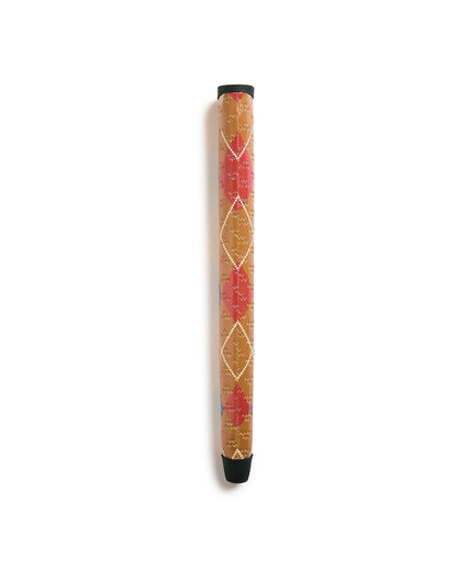 An argyle putter grip in tan and red with an all-over embossed logo and white dotted diamond pattern.