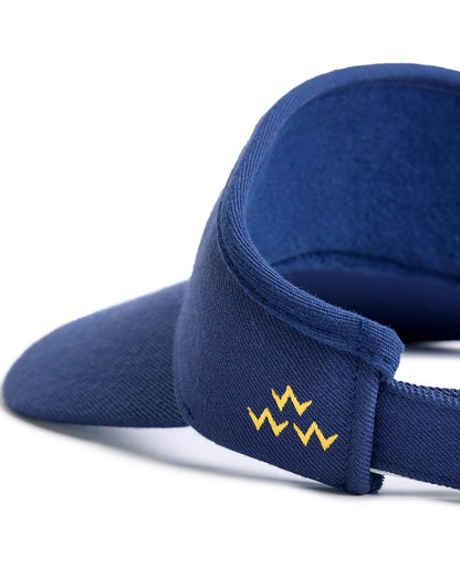 Detail of a navy cotton visor with a yellow triple zigzag logo and a textured terrycloth headband.