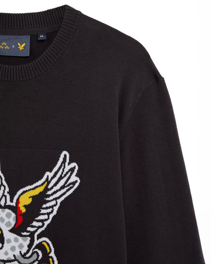 Detail of a black cotton crewneck sweater featuring an intarsia winged golf ball design.