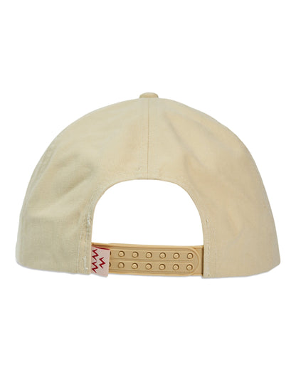 Back of a cream snapback hat with a double plug closure and a small red zig-zag label on the strap.
