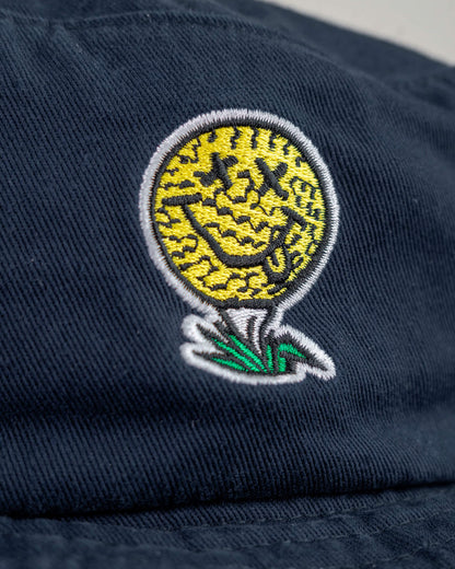 Detail of a navy cotton boonie featuring a yellow smiley face golf ball logo with X eyes on a tee.