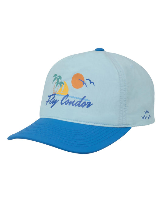 Sky blue five-panel cap with a royal blue brim, featuring a tropical sunset design and the text Fly Condor.