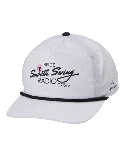 A white 5-panel rope cap featuring a black braided brim cord, black top button, and a radio station graphic.