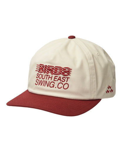 Natural cap with a red wine brim, top button, and front text reading BIRDS SOUTH EAST SWING.CO.