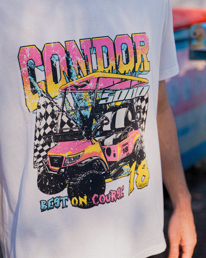 A person wearing a white t-shirt featuring a colourful retro golf cart and checkered flags graphic.
