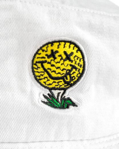 Detail of a white cotton boonie featuring a yellow and black smiling golf ball graphic on a tee.