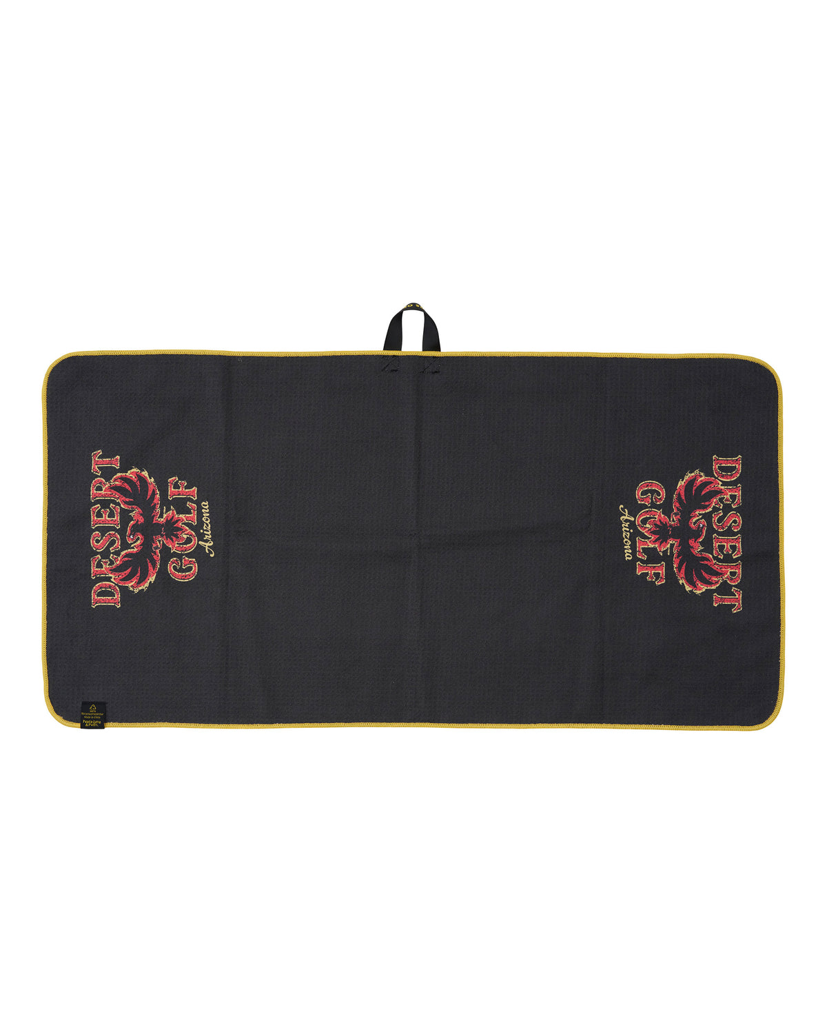 A black rectangular golf towel with a yellow border, featuring the 'Desert Golf' logo printed in red and gold on both sides. 