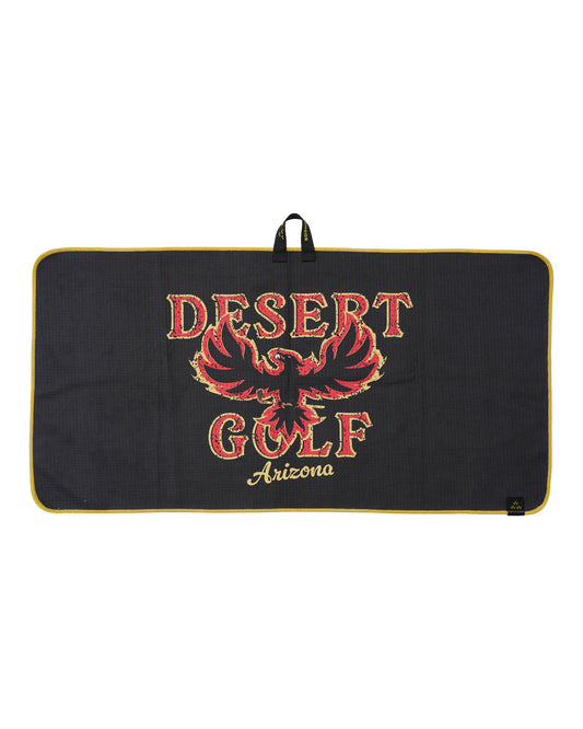 A black rectangular golf towel with a gold trim and handle, featuring a red and gold phoenix graphic and the text 'DESERT GOLF Arizona'.