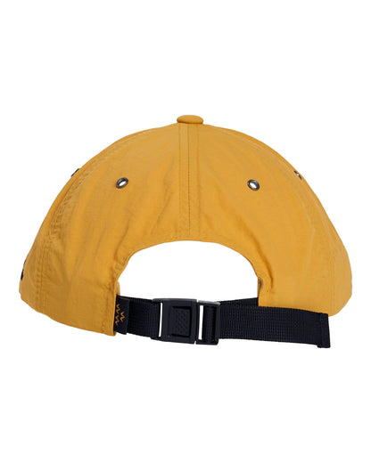 Back of a mustard nylon strapback hat with a black strap, buckle, and metal eyelets.