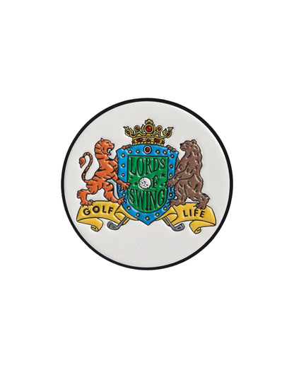 A white round golf ball marker featuring a colorful coat of arms design with a tiger, bear, and crown.