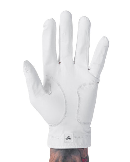 A white golf glove with stitched palm panels and a small square patch featuring a triple eagle motif.